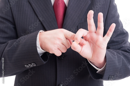 Businessman or accountant making obscene sex connotation gesture photo