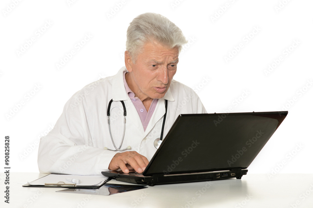 Elderly doctor with laptop Elderly doctor with laptop