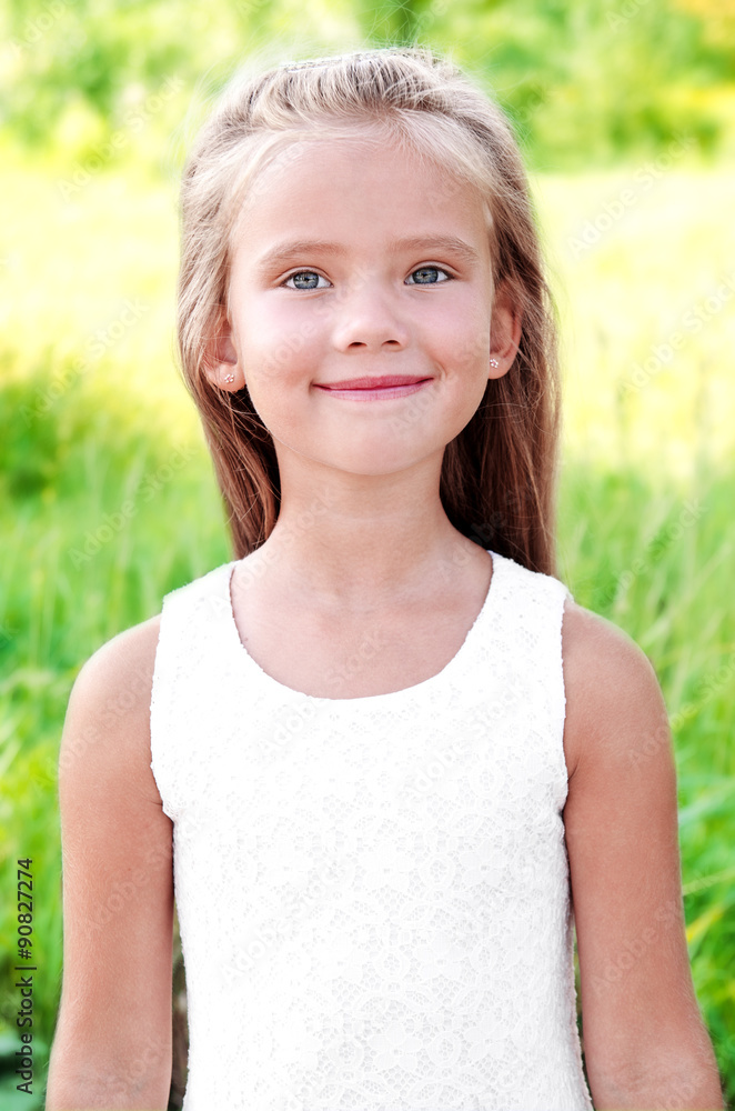 Portrait of smiling cute little girl in summer day Portrait of smiling cute little girl in summer day