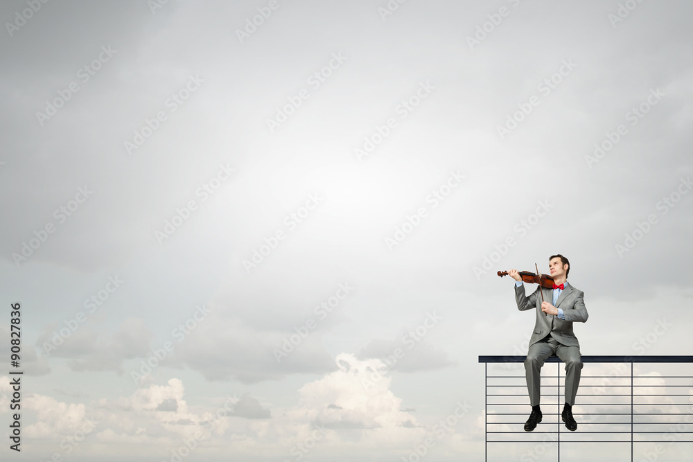 Businessman play violin