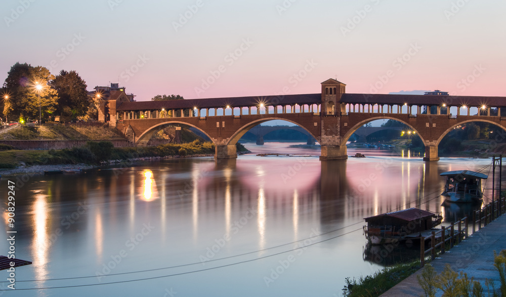 Pavia, Italy: Covered bridge over the river Ticino at sunset