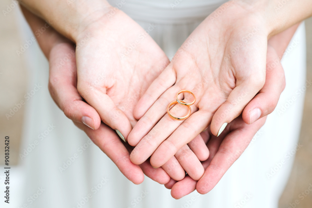 Couple hands holding engagement rings Stock Photo | Adobe Stock