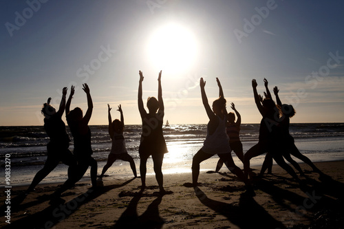 yoga exercise in group with back light