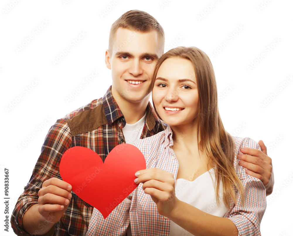  Happy couple in love holding red heart.
