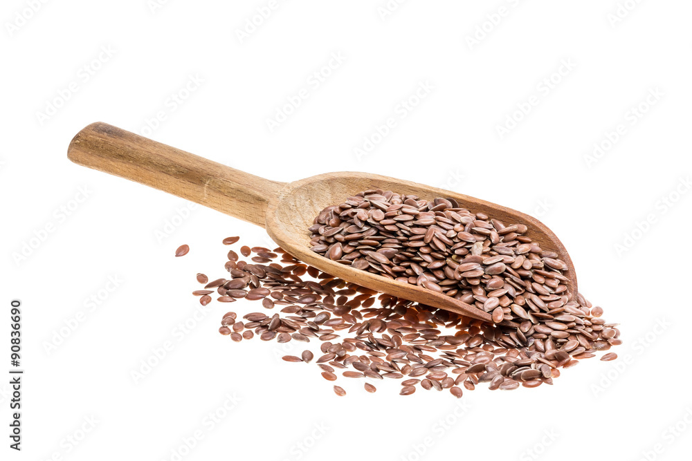 Flax linseedseeds on a wooden spoon with handle to the left isolated on white Flax linseedseeds on a wooden spoon with handle to the left isolated on white