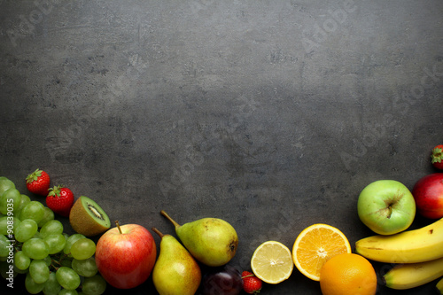 Fototapeta Naklejka Na Ścianę i Meble -  Fresh fruits on grey kitchen table