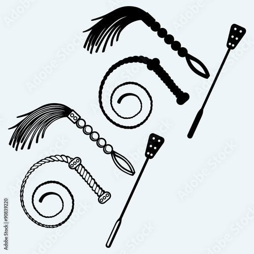 Three different types of whips for sexual role-playing and SM games. Isolated on blue background