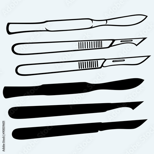 Medical scalpels. Isolated on blue background