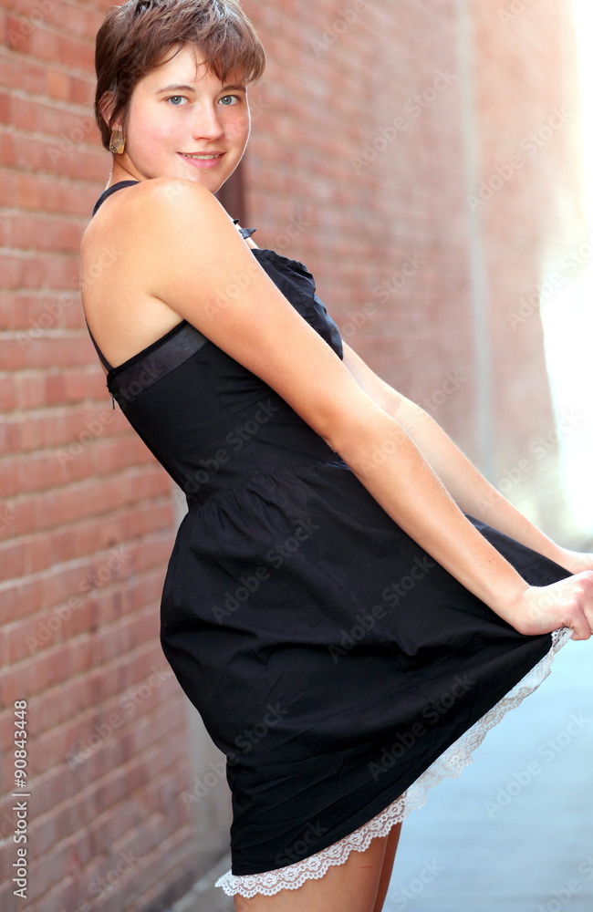 Female beauty expressions against a wall outside. Female beauty expressions against a wall outside.