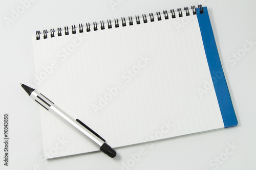 white notebook isolated on white background photo