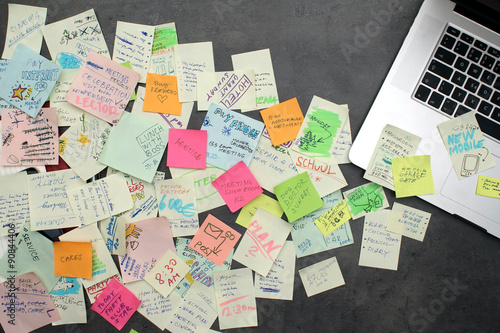 Post it papers flying out from laptop