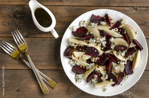 Apple salad with beetroot and walnuts blue cheese dressed with balsamic vinegar   