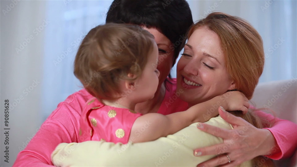 Happy together. Three generations of women in one family. Grandmother, mother and little girl playing, laughing and hugging. Happy together. Three generations of women in one family. Grandmother, mother and little girl playing, laughing and hugging.