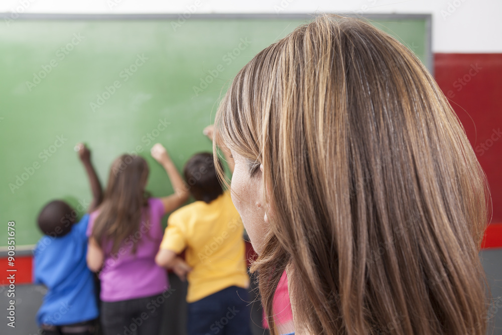 Fototapeta premium The teacher looking at hers students