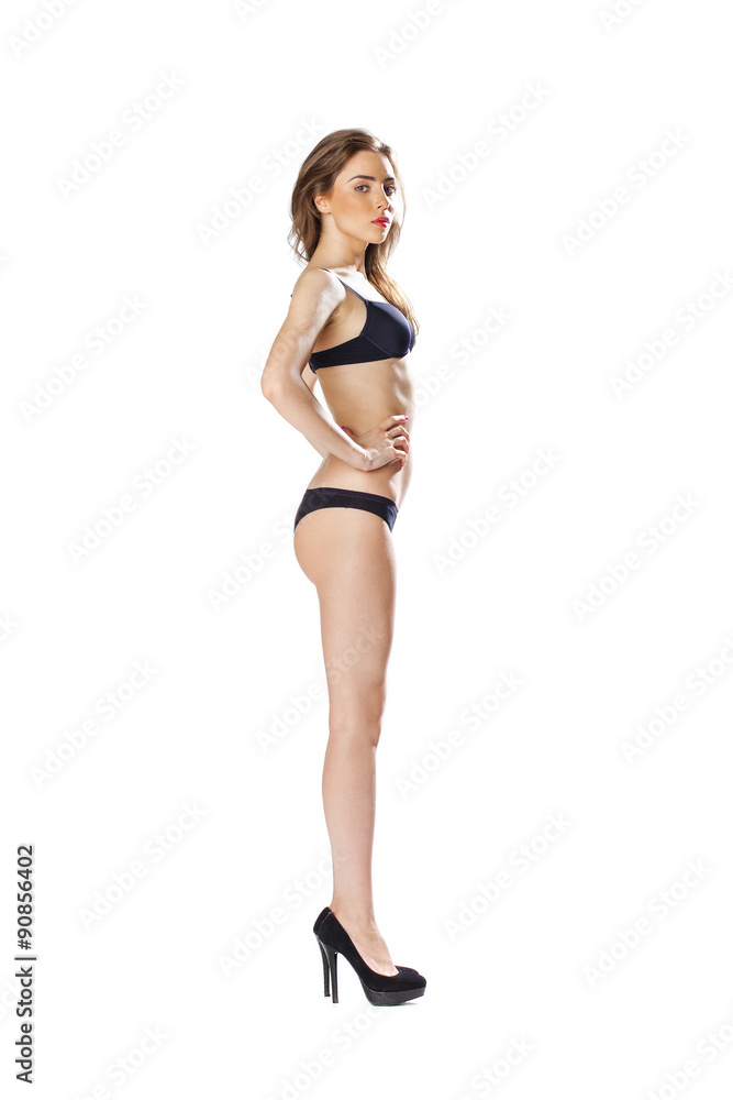 Full length portrait of a beautiful young model in black bikini Full length portrait of a beautiful young model in black bikini