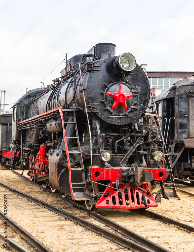 Fototapeta premium old black steam locomotive in Russia