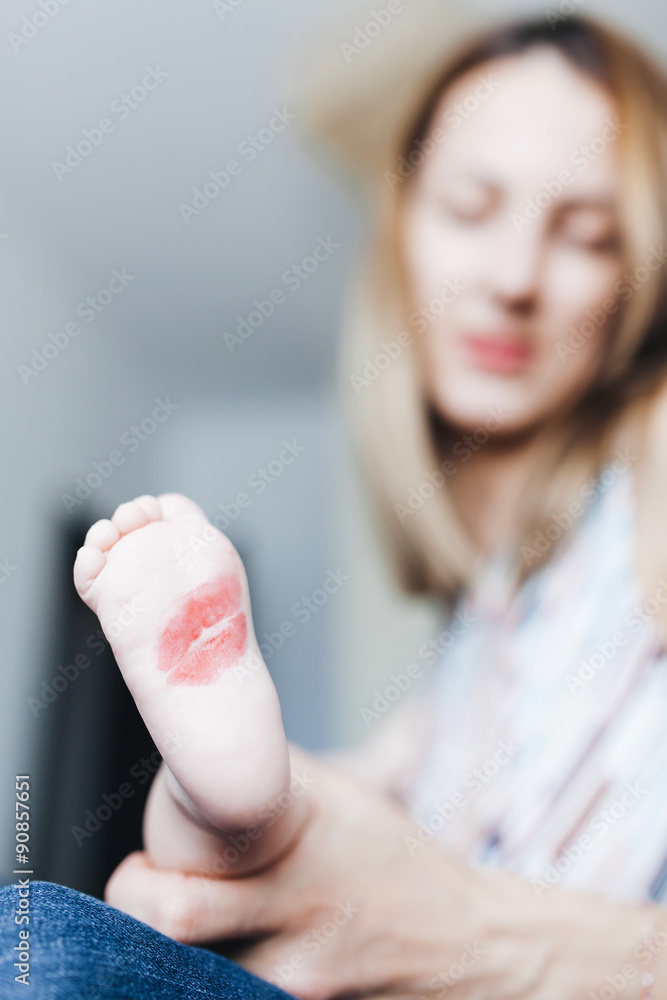 Naklejka premium Kissed baby foot