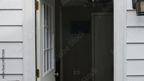 A household door opens then slams shut.