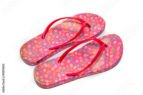 Used pink slippers on white background.
