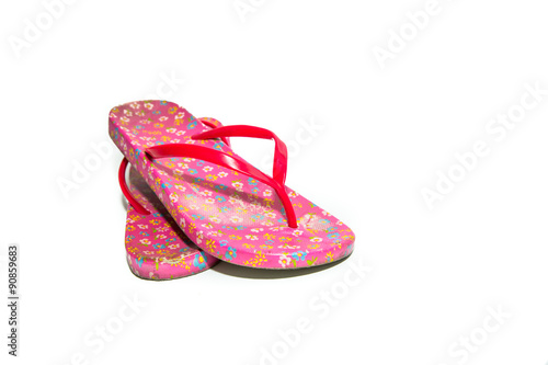Used pink slippers on white background.