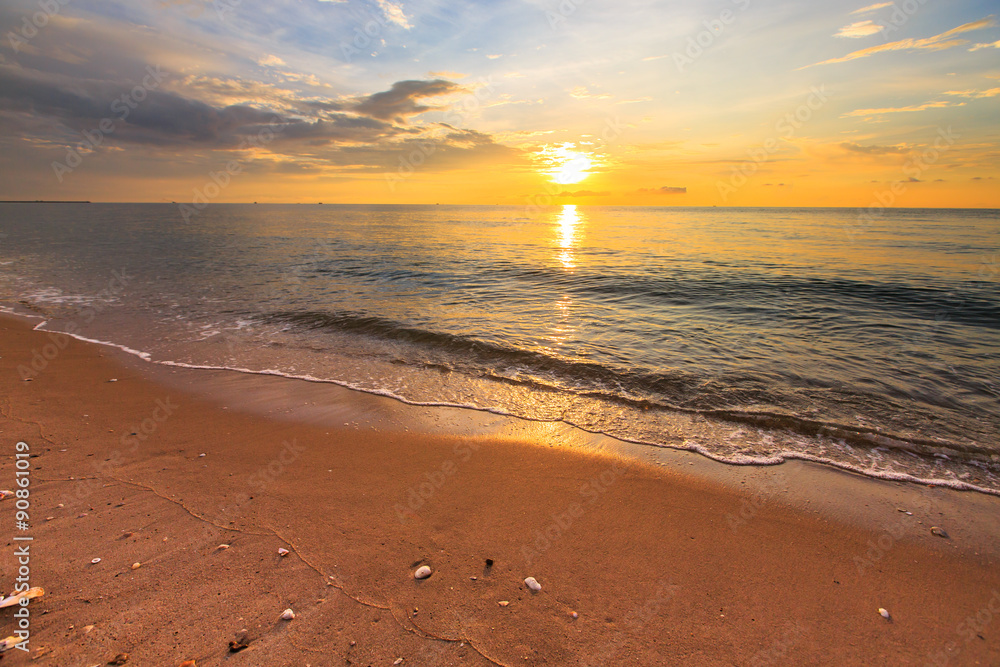Tropical beach with sunset sky and sea wave Tropical beach with sunset sky and sea wave