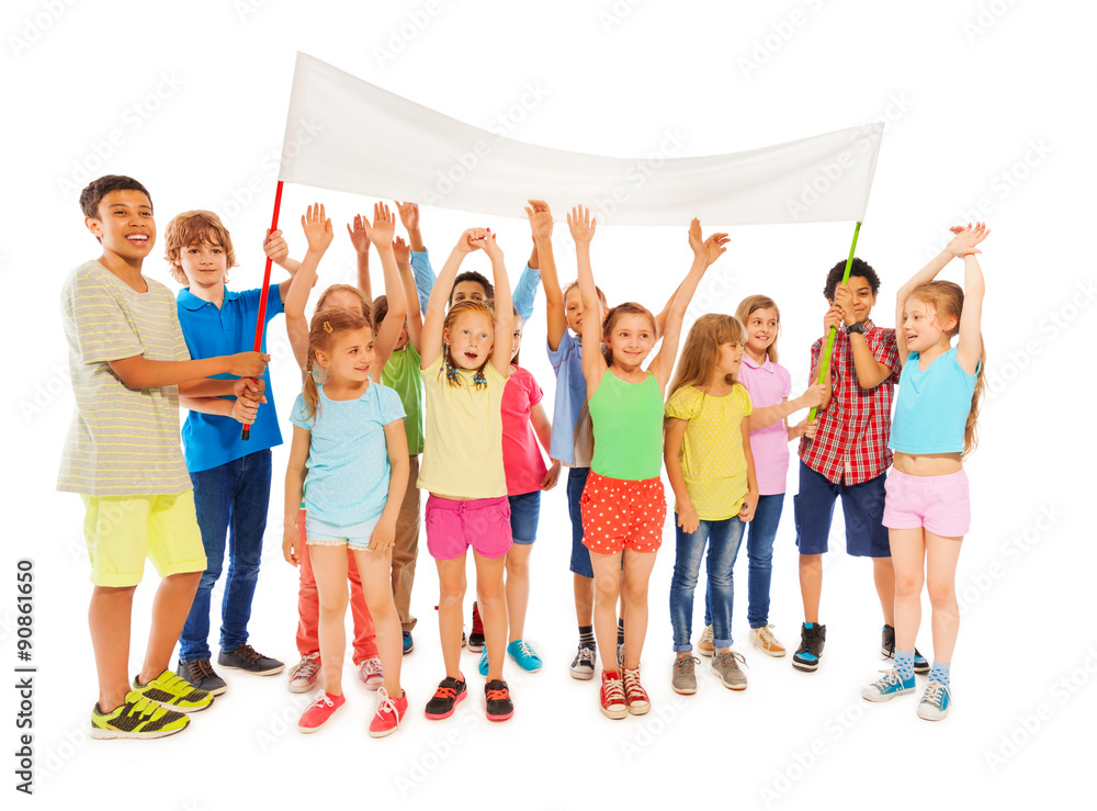 Fototapeta premium Many kids stand with blank banner