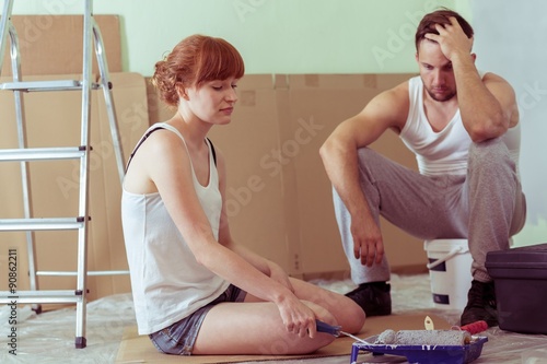 Despair couple renovating house photo