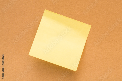 Empty sticky notepads on brown wall