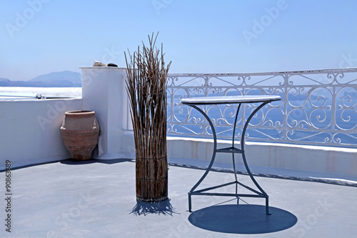 beautiful white terrace overlooking sea in Oia, Santorini, Cycla