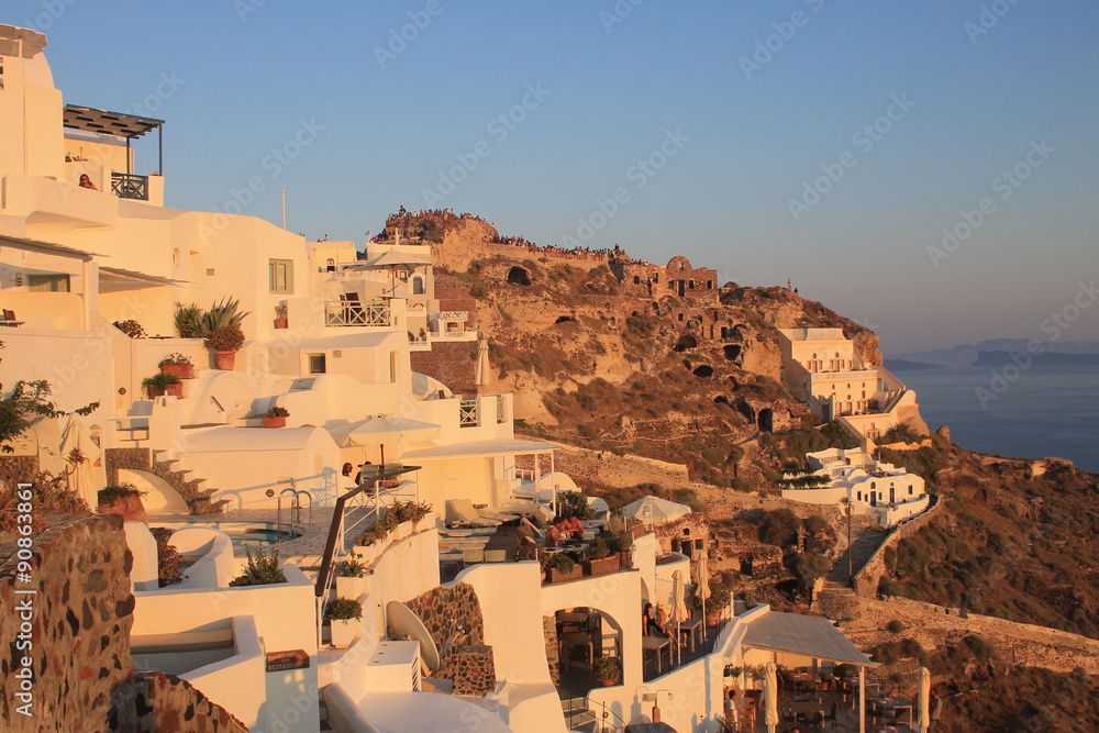 Fototapeta premium Beautiful sunset view in Oia, Santorini, Greece