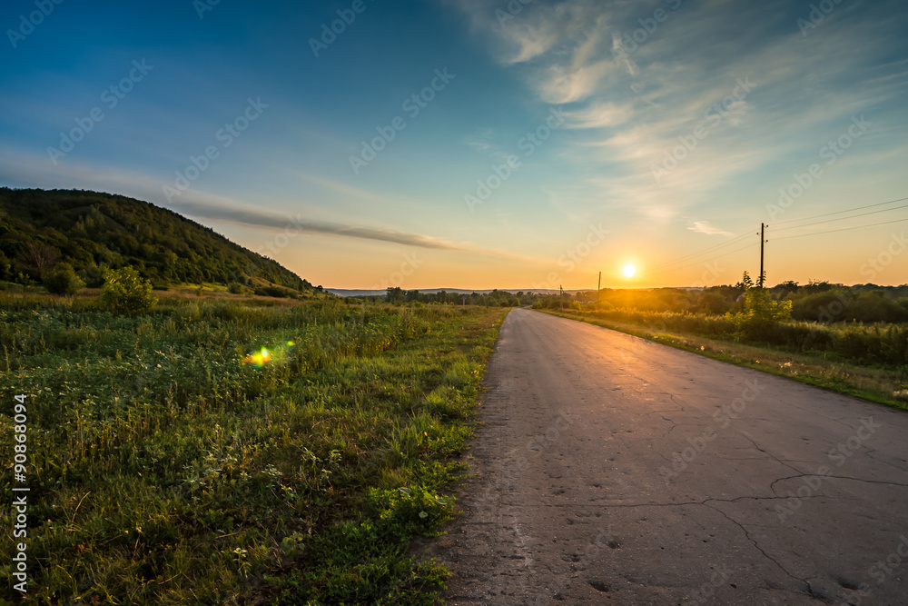 New day begins. Road and hill at sunrise. Russia