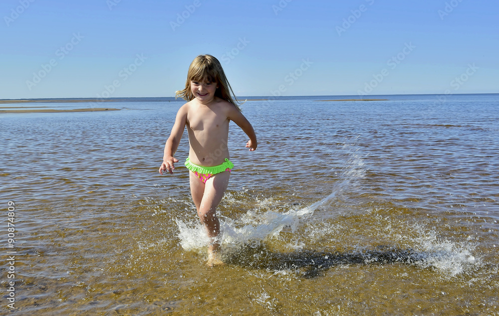 Adorable funny baby girl splashing in the water Adorable funny baby girl splashing in the water