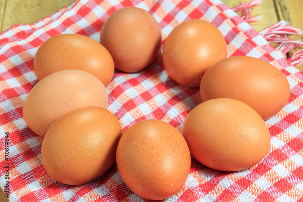 The eggs and cloth on the wood background. The eggs and cloth on the wood background.