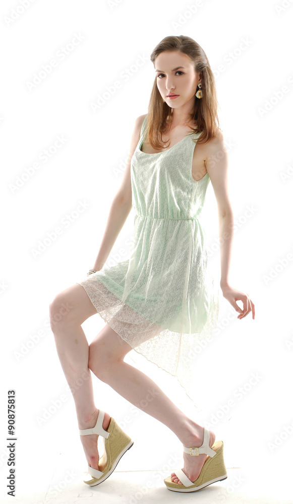 Naklejka premium Portrait of beautiful young fashion sitting cube