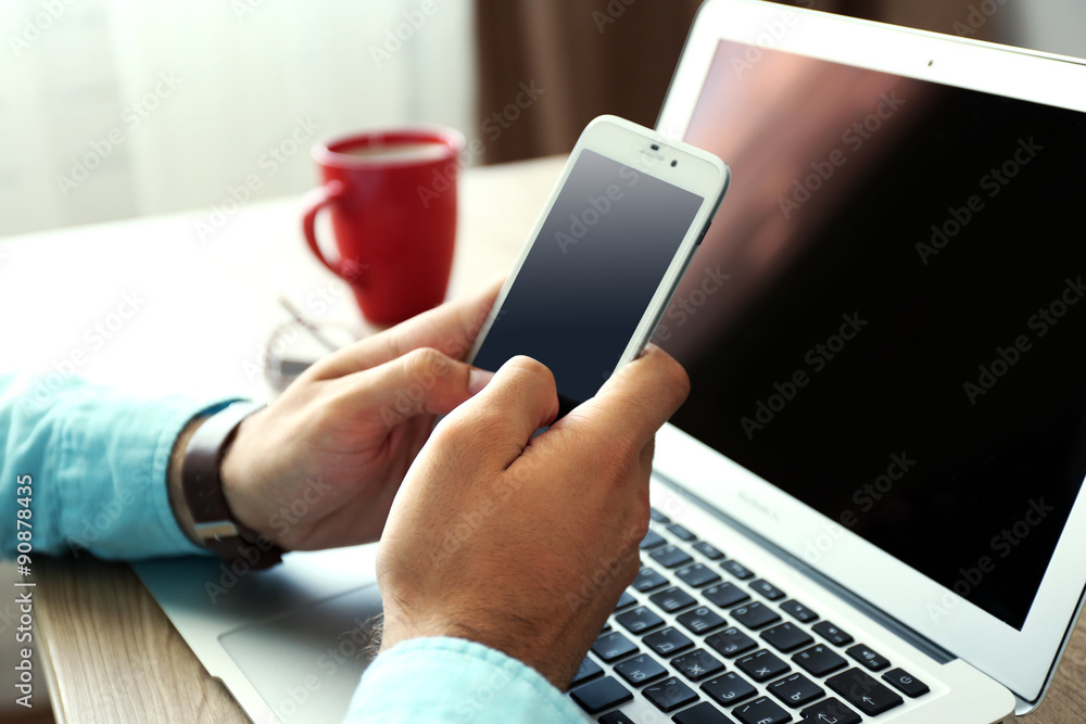 Man using mobile phone in office