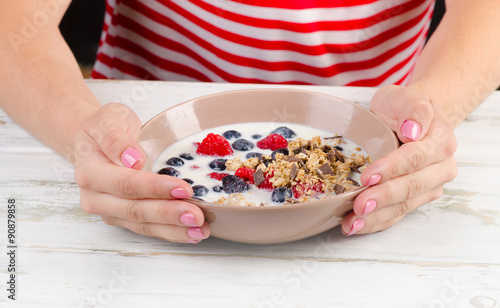 Yogurt with fresh berries, cereals and muesli.
