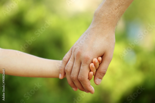 Father and daughter hands outdoors © Africa Studio
