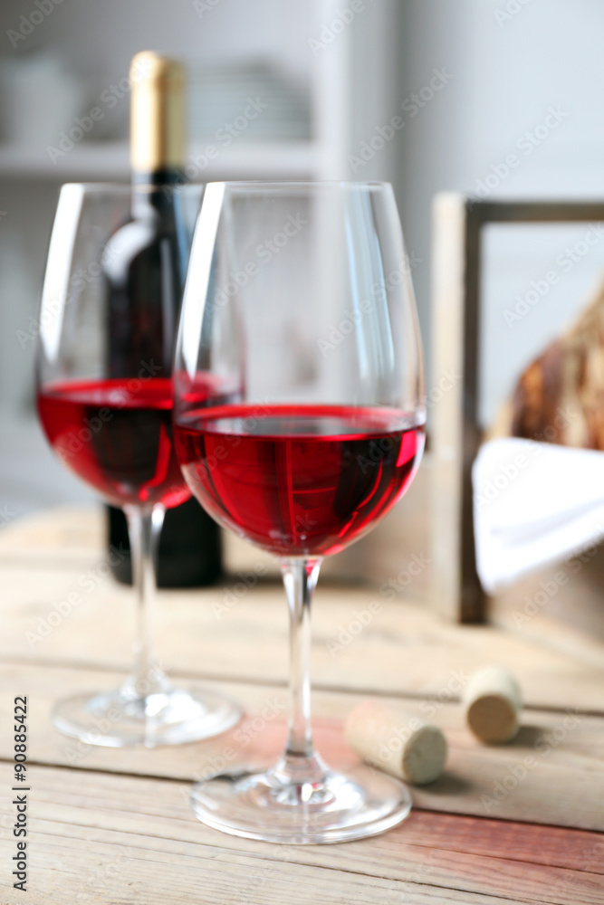 Still life of wine and bread on light background