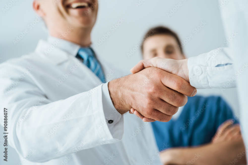 Doctors handshaking at hospital Doctors handshaking at hospital