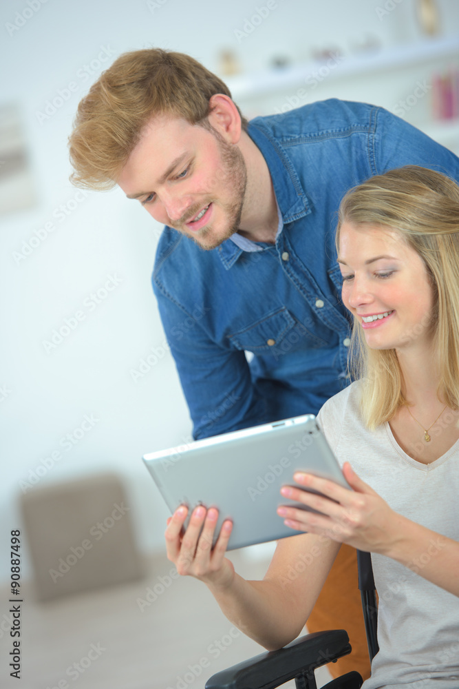 Couple using a tablet computer