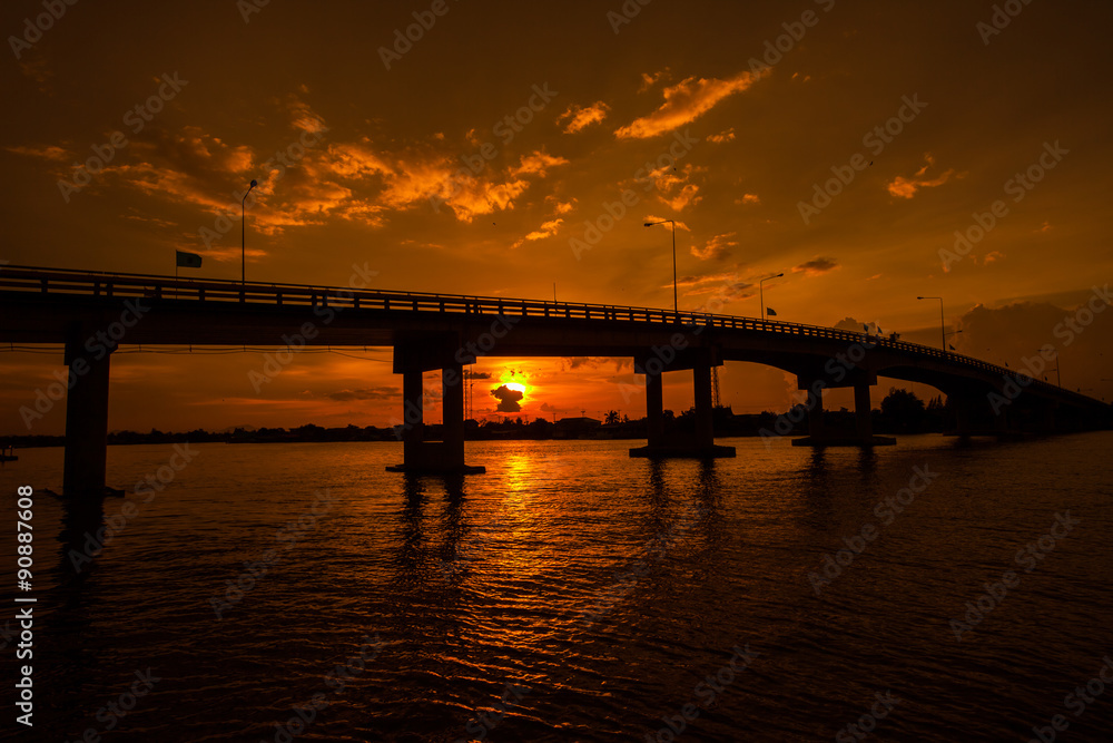 Silhouetted of Bridge over the river in Thailand.