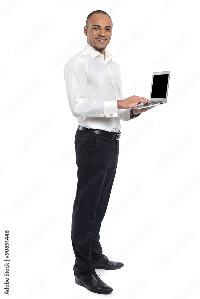 Businessman holding laptop Businessman holding laptop