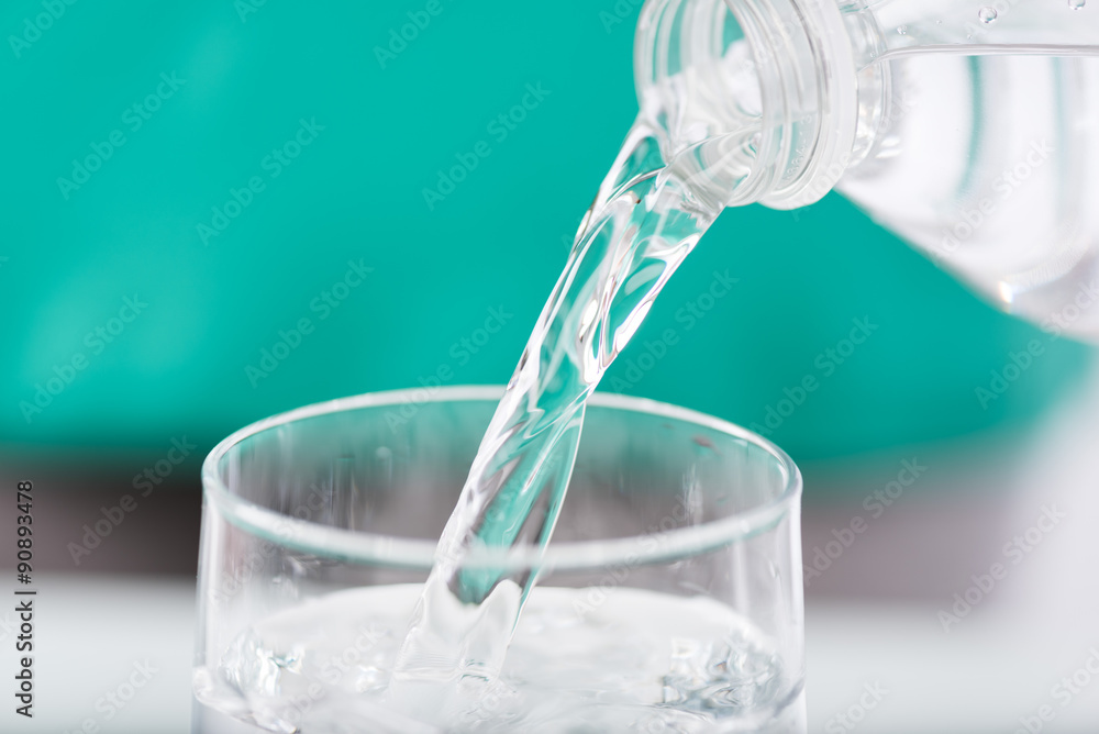 Pouring water into a glass Pouring water into a glass