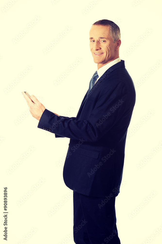 Mature man using digital tablet Mature man using digital tablet