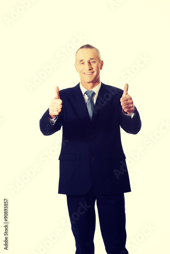 Mature businessman gesturing ok sign