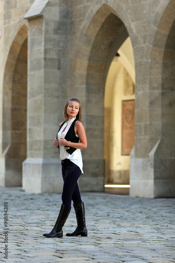 Elegant woman walking in the city