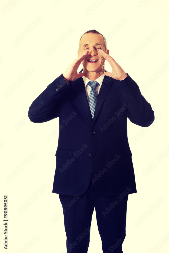 Mature businessman calling for someone Mature businessman calling for someone