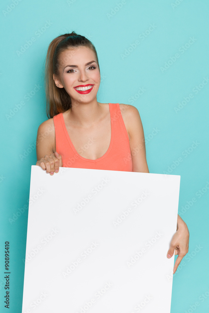 Girl With Beautiful Smile Holding White Poster Girl With Beautiful Smile Holding White Poster