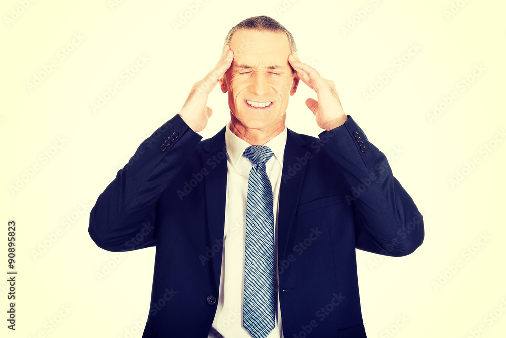 Businessman suffering from headache Businessman suffering from headache