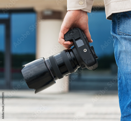 Photographer holding camera